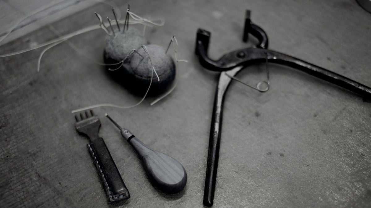 Thread, needles, hardware, and tools used for repairs